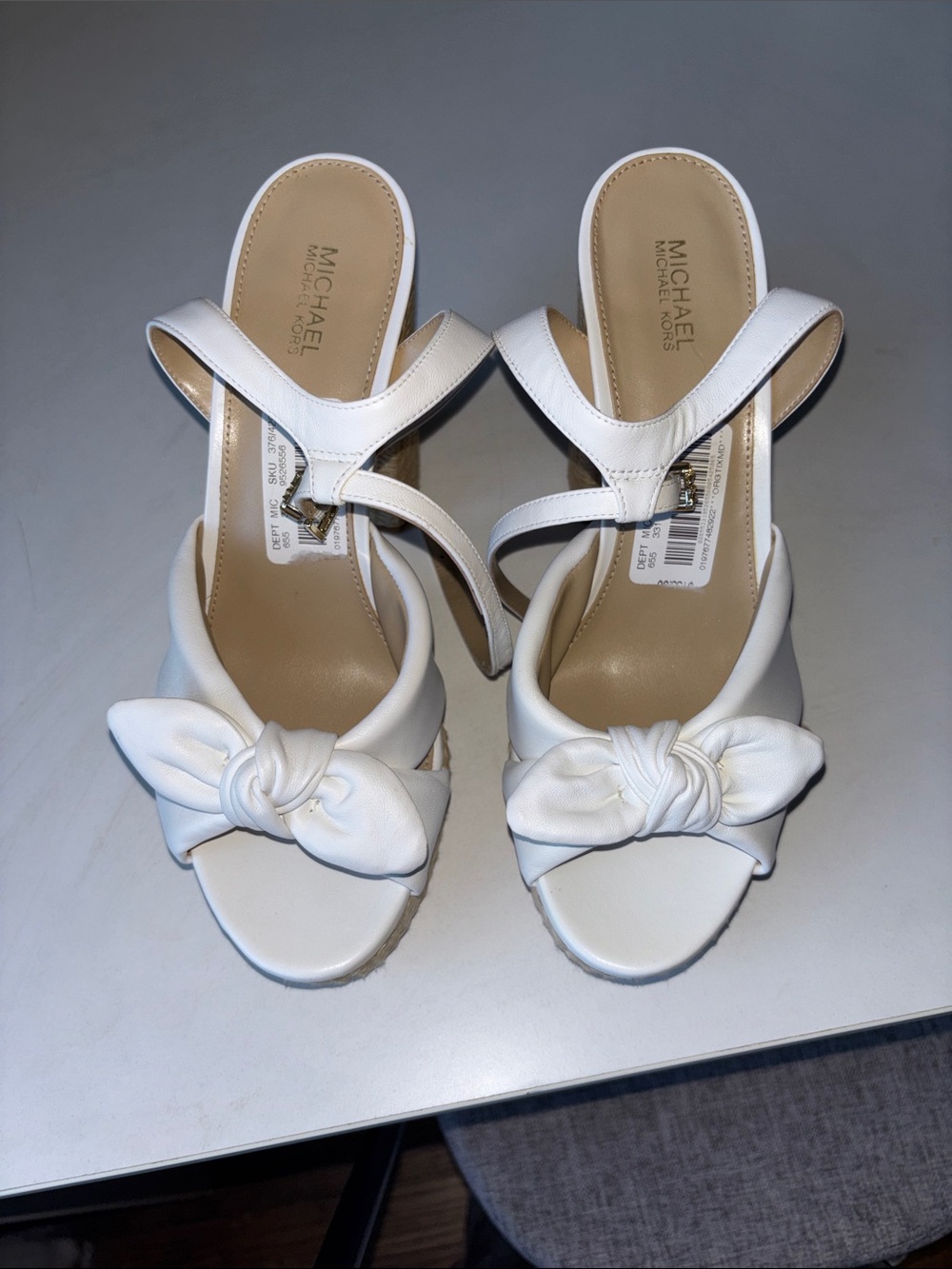 MICHAEL Michael Kors White Knot Front Wedge Mules very soft and comfortable.